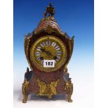 A BOULLE BALLOON CASED CLOCK BY MOUGIN, THE PENDULUM MOVEMENT STRIKING ON A COILED ROD, THE FACE
