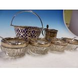 A HALLMARKED SILVER MUSTARD, A BLUE GLASS LINED SILVER BASKET AND FOUR SILVER MOUNTED GLASS SALTS.