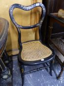 A PAIR OF VICTORIAN PAPIER MACHE BALLOON BACKED CHAIRS INLAID WITH MOTHER OF PEARL FLOWERS ABOVE