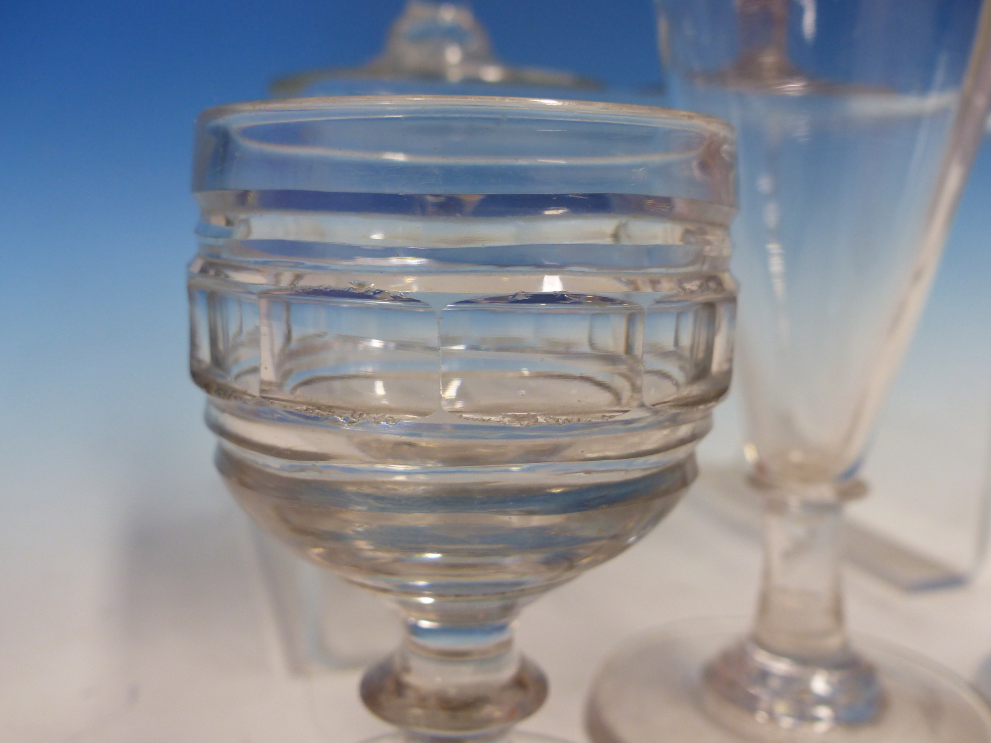 AN EARLY EUROPEAN SODA GLASS WINE, THE ENGRAVED CONICAL BOWL ABOVE FOLDED FOOT. H 14cms. THREE - Image 5 of 6