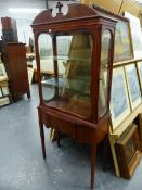 A REGENCY STYLE MAHOGANY AND INLAID SMALL DISPLAY CABINET ON STAND FITTED WITH SIDE OPENING DOORS