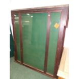 A LATE VICTORIAN MAHOGANY FRAMED GLAZED ROSETTE CABINET OR NOTICE BOARD WITH LOCKING CENTRAL DOOR.