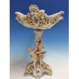 A GERMAN SITZENDORF STANDING BOWL, THE STEM WITH TWO CUPIDS PLAYING AMONGST ENCRUSTED FLOWERS. H.