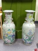 A PAIR OF CHINESE CELADON GROUND BALUSTER VASES PAINTED WITH FRUIT AND FLOWERS ABOUT POMEGRANATE