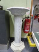 A MARBLE PEDESTAL BIRD BATH ON FLUTED COLUMN. H.108cms.