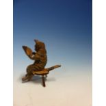 AN AUSTRIAN COLD PAINTED BRONZE FIGURE OF A CAT SEATED ON A STOOL READING PAPERS. H 5cms.