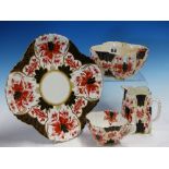 A WILEMAN IMARI PALETTE TWELVE PLACE TEA SET, THE CORNERS OF THE FLUTED SQUARE SHAPES PRINTED IN RED