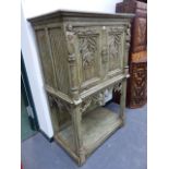 AN ANTIQUE AND LATER PAINTED OAK GOTHIC REVIVAL CABINET WITH LINEN FOLD PANELS AND PIERCED QUATREFOI