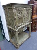 AN ANTIQUE AND LATER PAINTED OAK GOTHIC REVIVAL CABINET WITH LINEN FOLD PANELS AND PIERCED QUATREFOI