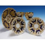 A PAIR OF MEISSEN CUPS AND SAUCERS RELIEF DECORATED WITH BLUE AND GILT PANELS TOGETHER A SIMILARLY