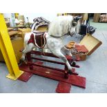AN EARLY 20th.C.ROCKING HORSE ON TRESTLE BASE, RESTORED 2001 BY H&D CRAMMOND. HOOF TO EAR 97cms.