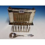 A SILVER FRAMED CALENDAR, BIRMINGHAM 1931. W 20.5cms. A SEVEN BAR TOAST RACK BY W G & S,