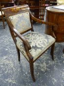 AN ANTIQUE DUTCH MARQUETRY INLAID MAHOGANY ARMCHAIR WITH SCROLL ARMS AND SABRE FORELEGS.