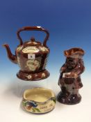 A BARGE WARE TEA POT AND STAND PRESENTED TO A FRIEND, A TREACLE GLAZED SNUFF TAKER TOBY JUG AND AN