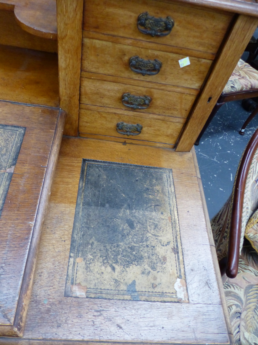 AN OAK PEDESTAL DICKENS DESK, THE LEATHER INSET FALL FLANKED BY FURTHER INSETS BEFORE - Image 3 of 9
