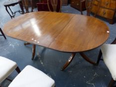A MAHOGANY D-END DINING TABLE WITH SINGLE LEAF, THE SUPPORTING TWO COLUMNS EACH ON THREE DOWN