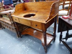 A VICTORIAN MAHOGANY WASHSTAND WITH HIGH GALLERY BACK, BOWL RECESS AND TWO SHORT DRAWERS ON TURNED