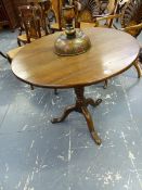 A GEORGIAN OAK TRIPOD TABLE, THE CIRCULAR TOP ON BALUSTER COLUMN, THE LEGS WITH LONG NOSED CLUB