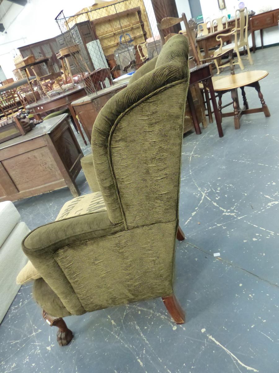 A WING ARMCHAIR UPHOLSTERED IN DARK OLIVE CORDUROY, THE STAINED WOOD FRONT LEGS CARVED WITH SHELLS - Image 4 of 4