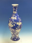 A 19th.C.CHINESE BLUE AND WHITE BALUSTER VASE PAINTED WITH PRUNUS ON A CRACKED ICE GROUND. H.45cms.