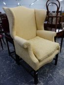 A 19th.C.WING BACK ARMCHAIR OF GENEROUS PROPORTIONS ON MOULDED SQUARE FORELEGS.