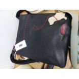 A DEBENHAMS BLACK LEATHER SHOULDER BAG SEWN IN RED AND FAWN LEATHER WITH A DACHSHUND ON A LEAD BY