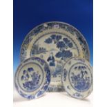 THREE NANKIN BLUE AND WHITE DISHES VARIOUSLY PAINTED WITH GARDENS AND WITH ISLAND SCENES. Dia 26 AND