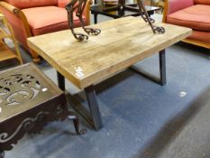 A PINE RUSTIC THREE PLANK TOPPED COFFEE TABLE ON IRON TRESTLE SUPPORTS. W 95 x D 60 x H 44.5cms.