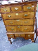 A GEO.III AND LATER WALNUT AND INLAID CHEST ON STAND WITH THREE SHORT AND THREE LONG GRADUATED