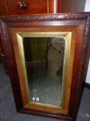 A LATE VICTORIAN OAK FRAMED MIRROR. 86 x 55cms.