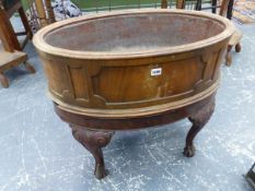 A 19th.C.MAHOGANY OVAL WINE COOLER WITH ZINC LINER ON STAND WITH CARVED CABRIOLE LEGS. 75 x 47 x H.