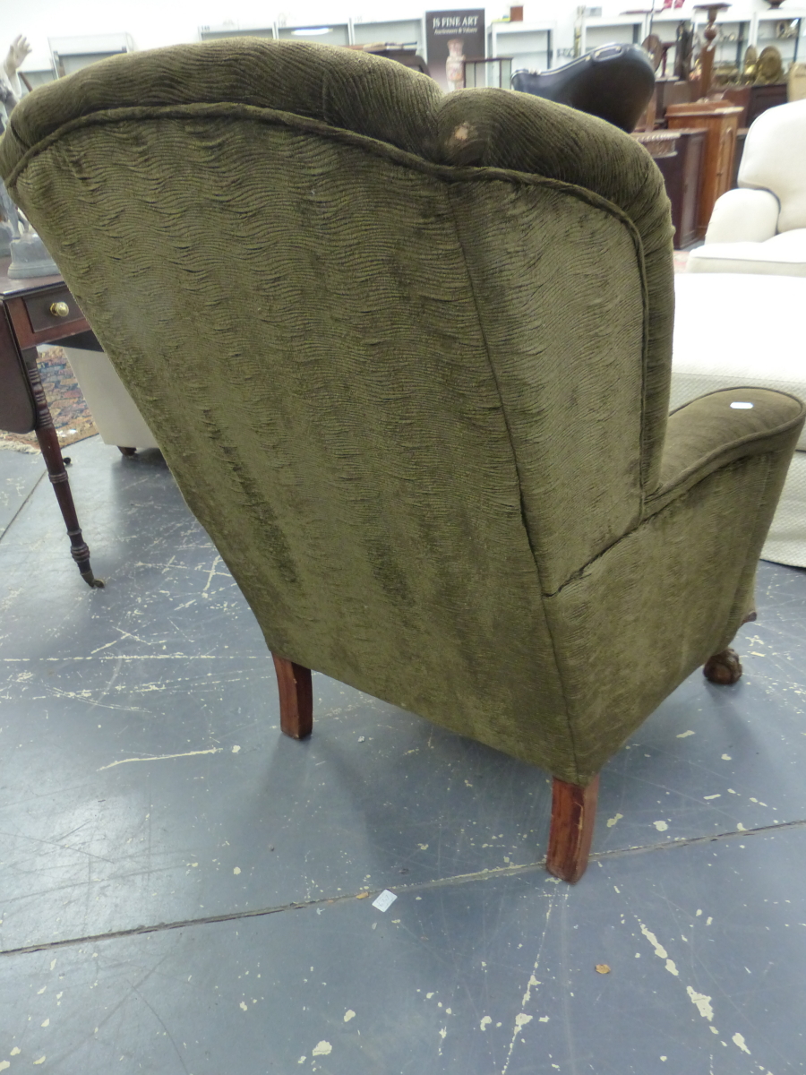 A WING ARMCHAIR UPHOLSTERED IN DARK OLIVE CORDUROY, THE STAINED WOOD FRONT LEGS CARVED WITH SHELLS - Image 3 of 4