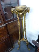 A NEO CLASSICAL STYLE GILTWOOD TORCHERE STAND WITH RAMS HEAD MASKED DECORATION. H.133cms.