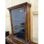 A ROSEWOOD SIDE CABINET, THE GLAZED DOOR BETWEEN LEAF TOPPED PILASTERS AND ENCLOSING BLUE VELVET