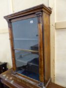 A ROSEWOOD SIDE CABINET, THE GLAZED DOOR BETWEEN LEAF TOPPED PILASTERS AND ENCLOSING BLUE VELVET