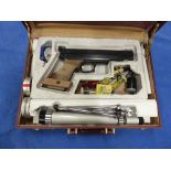 AN EL GAMO PNEUMATIC TARGET AIR PISTOL SERIAL NUMBER 0288577 IN A FITTED CASE WITH ACCESSORIES.