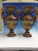 A PAIR OF SCHILLER AND SONS MAJOLICA TWO HANDLED BALUSTER VASES DECORATED IN RELIEF WITH ROMAN