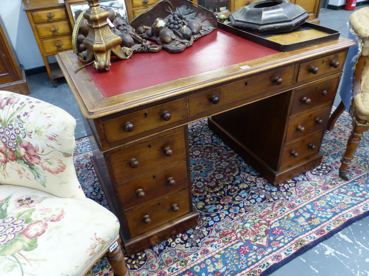 A VICTORIAN MAHOGANY TWIN PEDESTAL WRITING DESK WITH ARRANGEMENT OF NINE DRAWERS STANDING ON