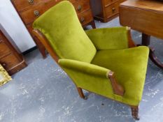 A PAIR OF LATE VICTORIAN FIRESIDE ARMCHAIRS WITH SHOW FRAMES AND GREEN VELVET UPHOLSTERY. (2)