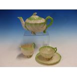 BLACK MARKED BELLEEK TEA WARES, EACH OF THE SHELL SHAPES WITH GREEN RIMS, COMPRISING A TRAY, A