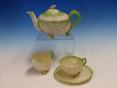 BLACK MARKED BELLEEK TEA WARES, EACH OF THE SHELL SHAPES WITH GREEN RIMS, COMPRISING A TRAY, A