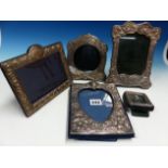 A GROUP OF FIVE VARIOUS ART NOUVEAU SILVER PHOTO FRAMES.