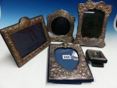 A GROUP OF FIVE VARIOUS ART NOUVEAU SILVER PHOTO FRAMES.