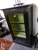 A PAINTED WOOD SIDE CABINET, THE BLACK RECTANGULAR TOP WITH GREEN EDGE FLORAL SPANDRELS AND WHITE