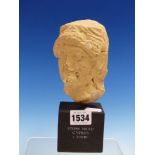A THIRD TO SECOND CENTURY BC CYPRIOT STONE HEAD OF A MAN, ON WOOD PLINTH. H.14cms.
