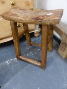 A CHINESE RUSTIC ELM JOINT STOOL WITH BOWED RECTANGULAR SEAT, THE FOUR ROUNDED SQUARE SECTIONED LEGS