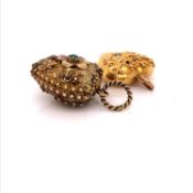 TWO ANTIQUE GOLD HEART PENDANTS. ONE A LOCKET WITH A HINGED UP AND OVER OPENING CONTAINING A LOCK OF