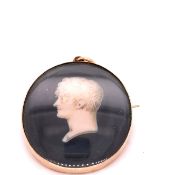 A GEORGIAN GOLD MOUNTED PAINTED PORTRAIT MINIATURE OF A BUST PROFILE, SIGNED INDISTINCTLY,