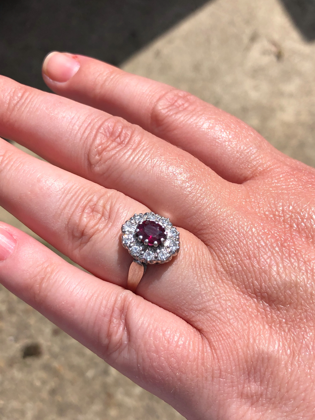 AN 18ct WHITE GOLD RUBY AND DIAMOND CLUSTER RING. THE OVAL CLAW SET RUBY SURROUNDED BY A CLUSTER - Image 16 of 18