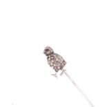 AN ANTIQUE DIAMOND SET STICK PIN. THE CHICK FORM PIN IS PAVE SET WITH OLD CUT DIAMONDS. HEIGHT